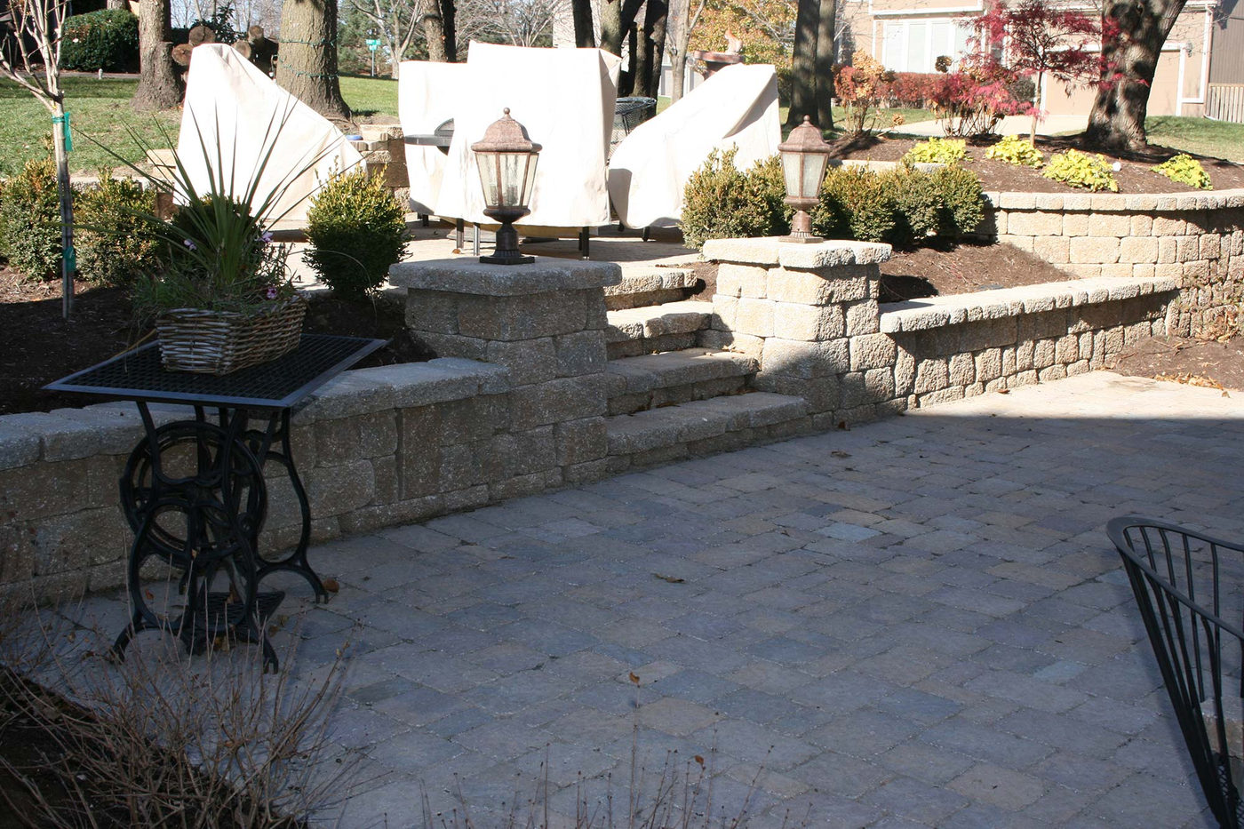 Natural stone retaining wall built by Outlook Hardscape